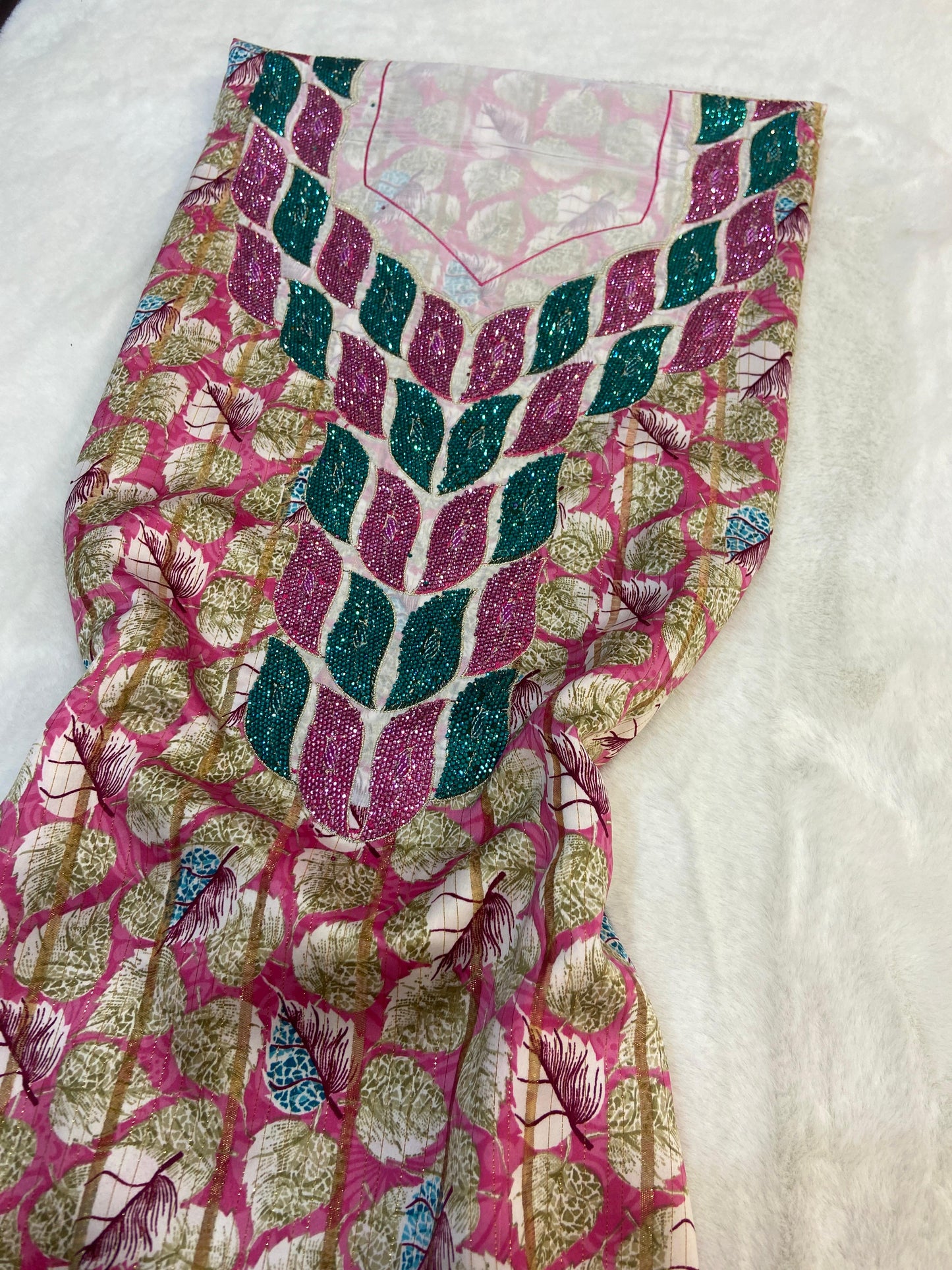This luxurious Indonesian silk is presented in a new design, adorned with delicately set stones and six beads