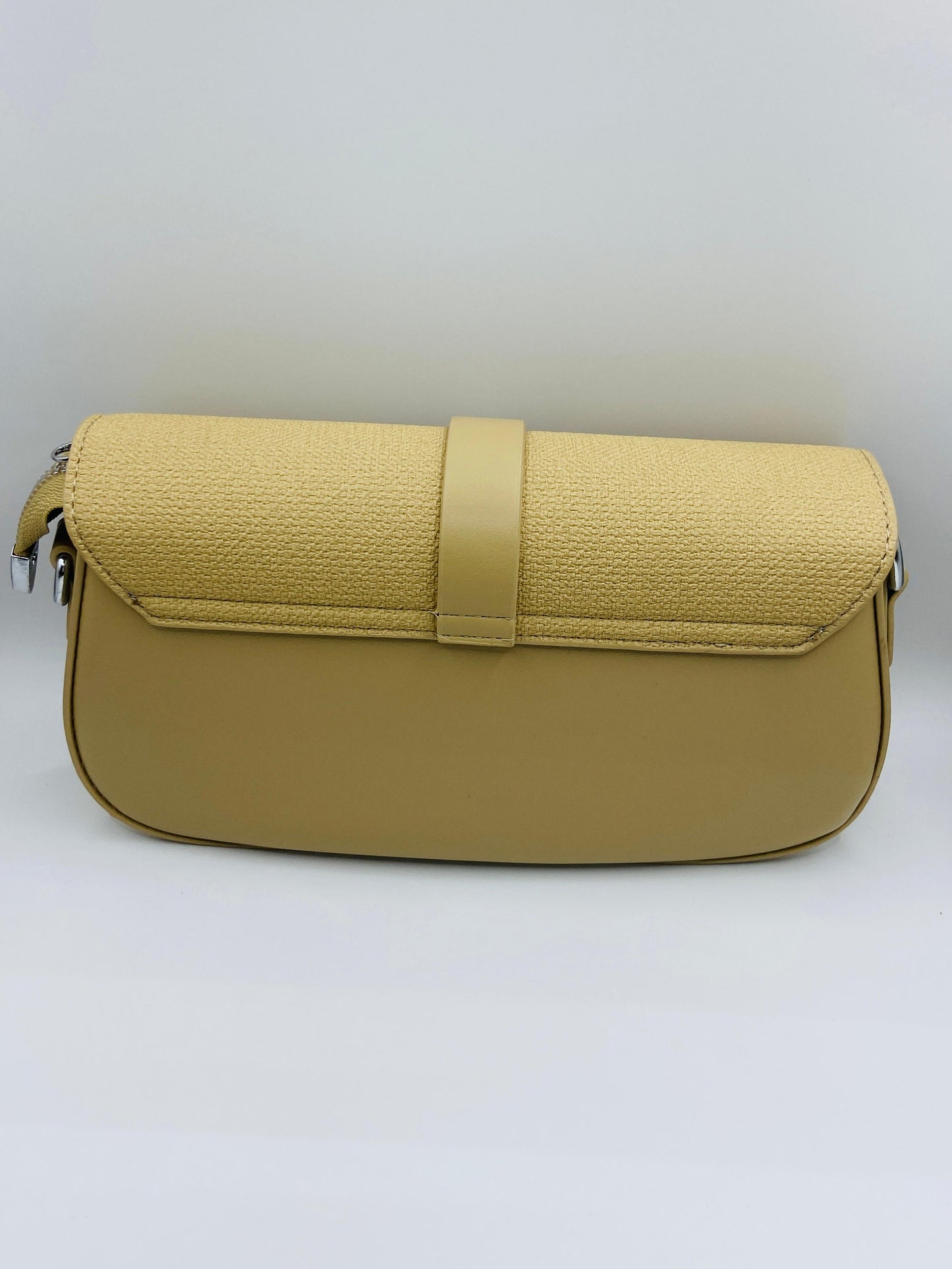 This handbag is a structured, genuine leather tote-style bag designed for modern women who value both elegance and functionality.