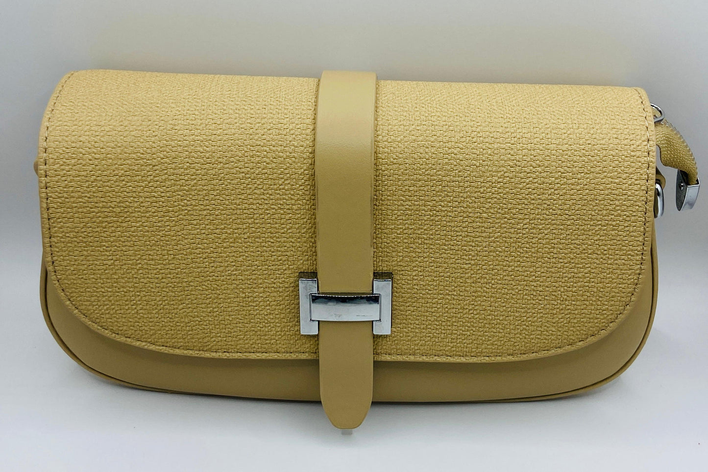 This handbag is a structured, genuine leather tote-style bag designed for modern women who value both elegance and functionality.