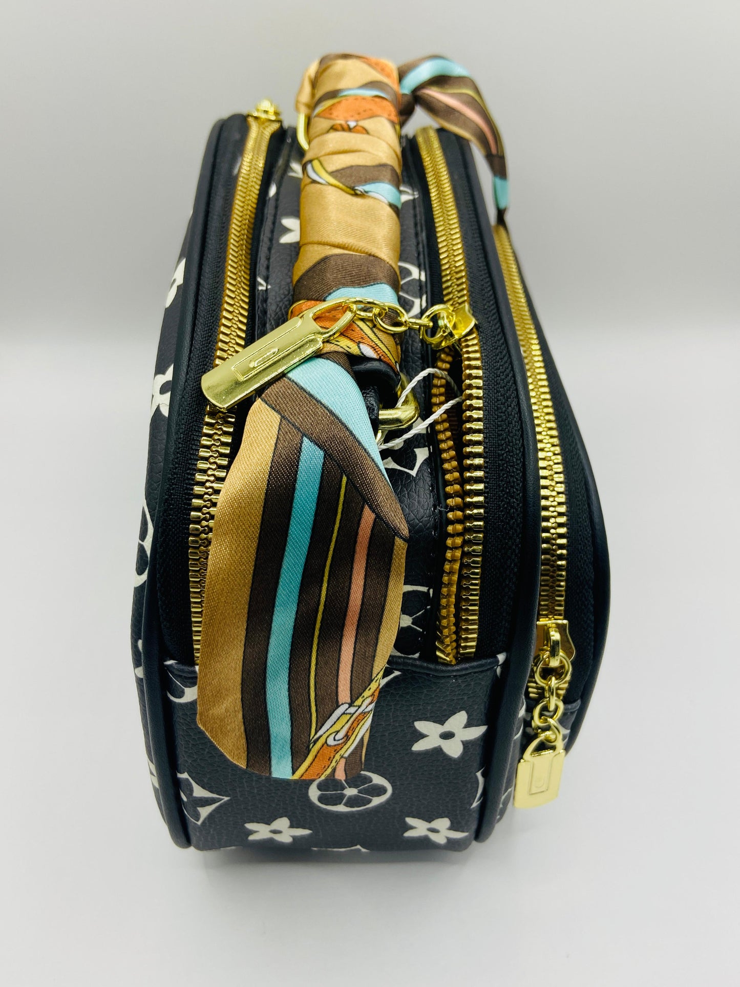 This handbag is a structured, genuine leather tote-style bag designed for modern women who value both elegance and functionality.