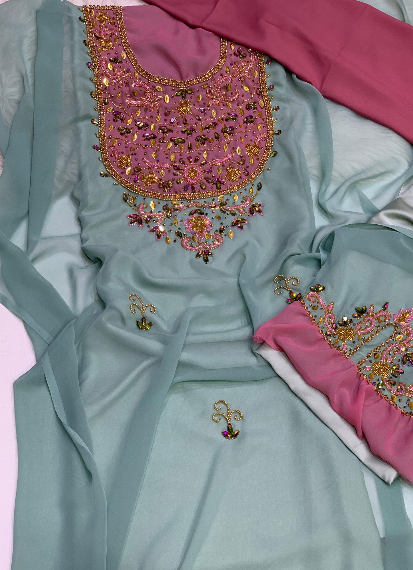 This elegant piece features chiffon with luxurious hand-beaded embroidery, and is lined with Armani silk for ultimate comfort and elegance