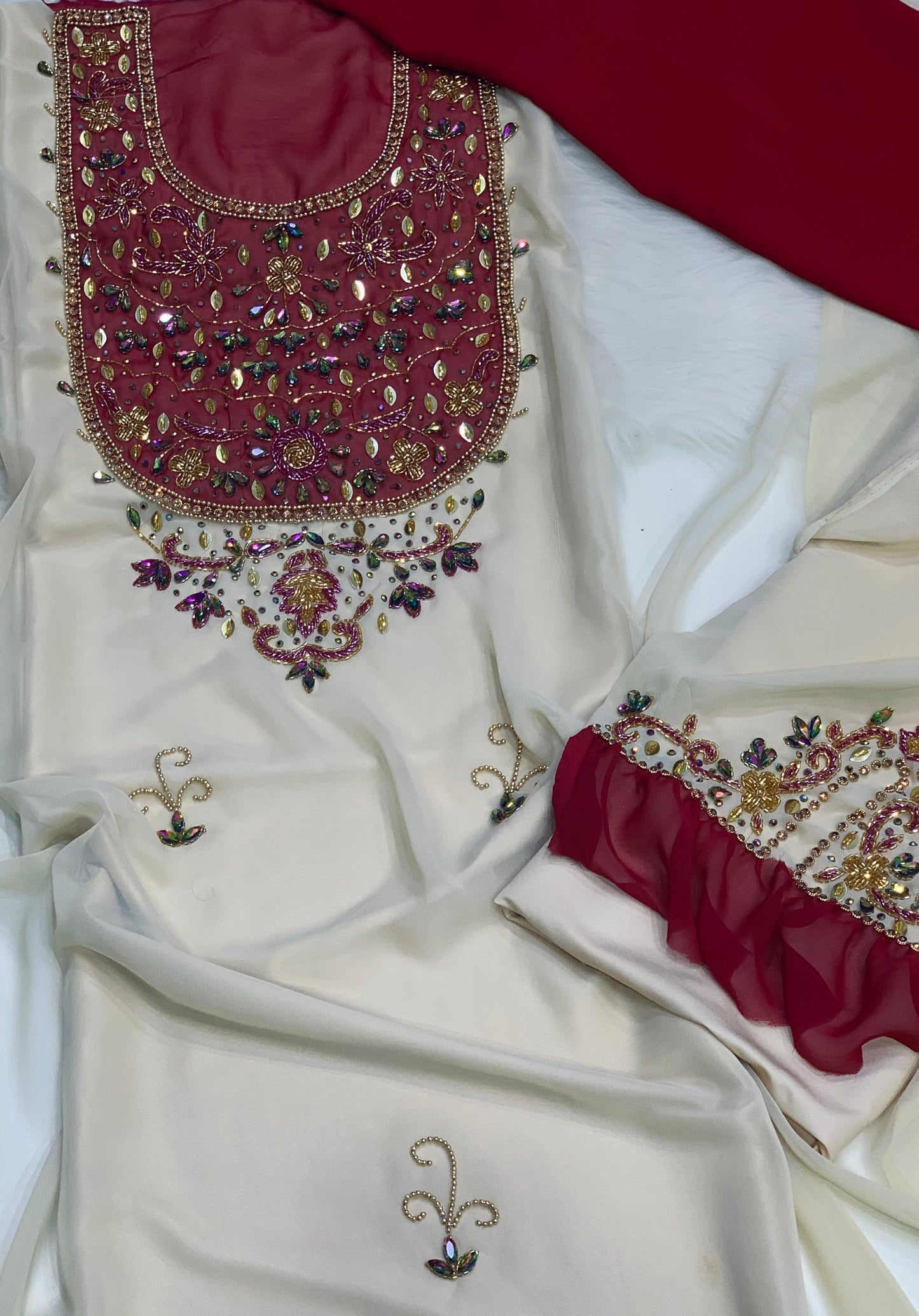 This elegant piece features chiffon with luxurious hand-beaded embroidery, and is lined with Armani silk for ultimate comfort and elegance