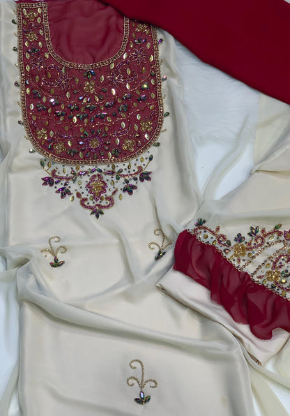 This elegant piece features chiffon with luxurious hand-beaded embroidery, and is lined with Armani silk for ultimate comfort and elegance