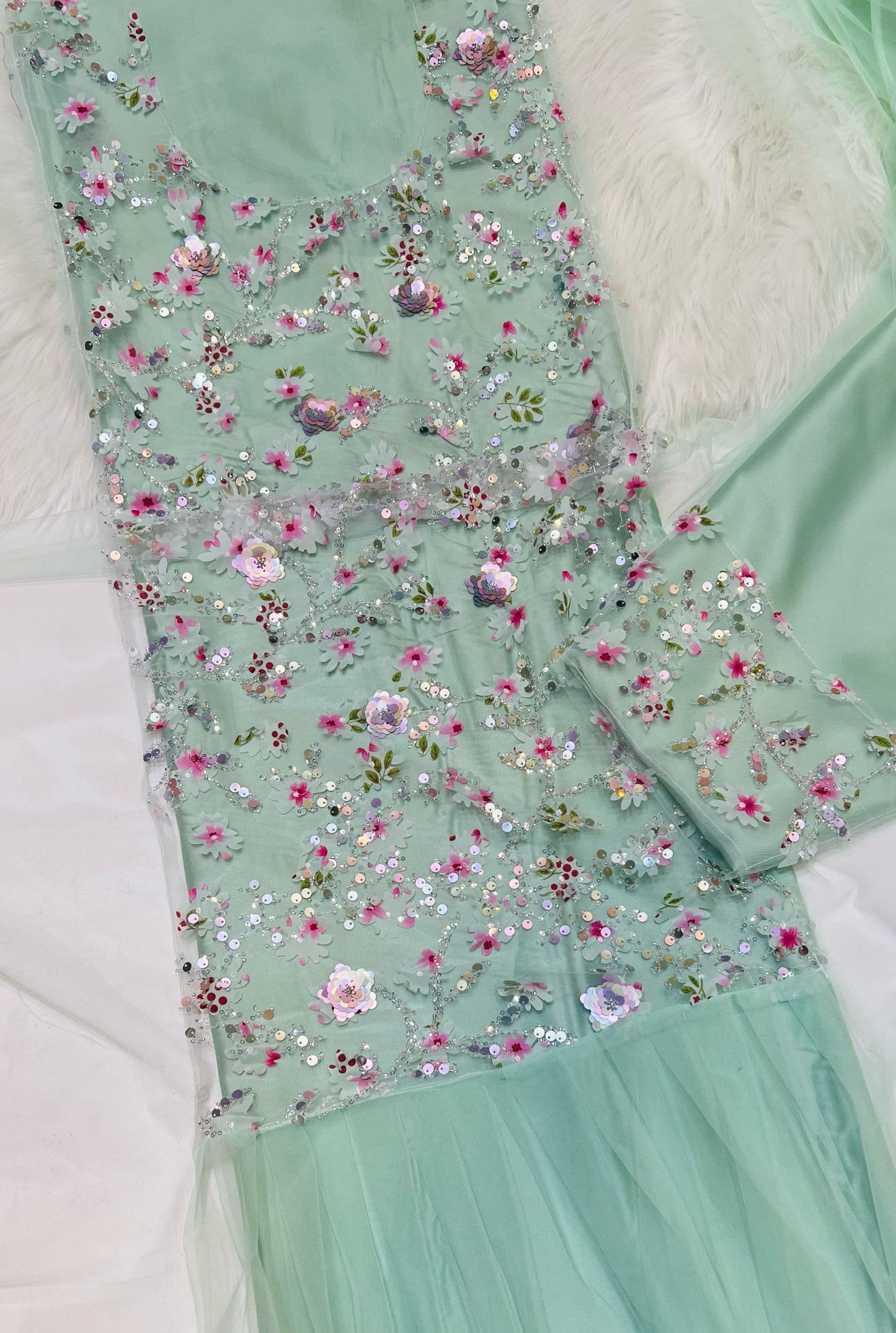 This Jadam dress is crafted from high-quality tur fabric and lined with soft Armani silk,