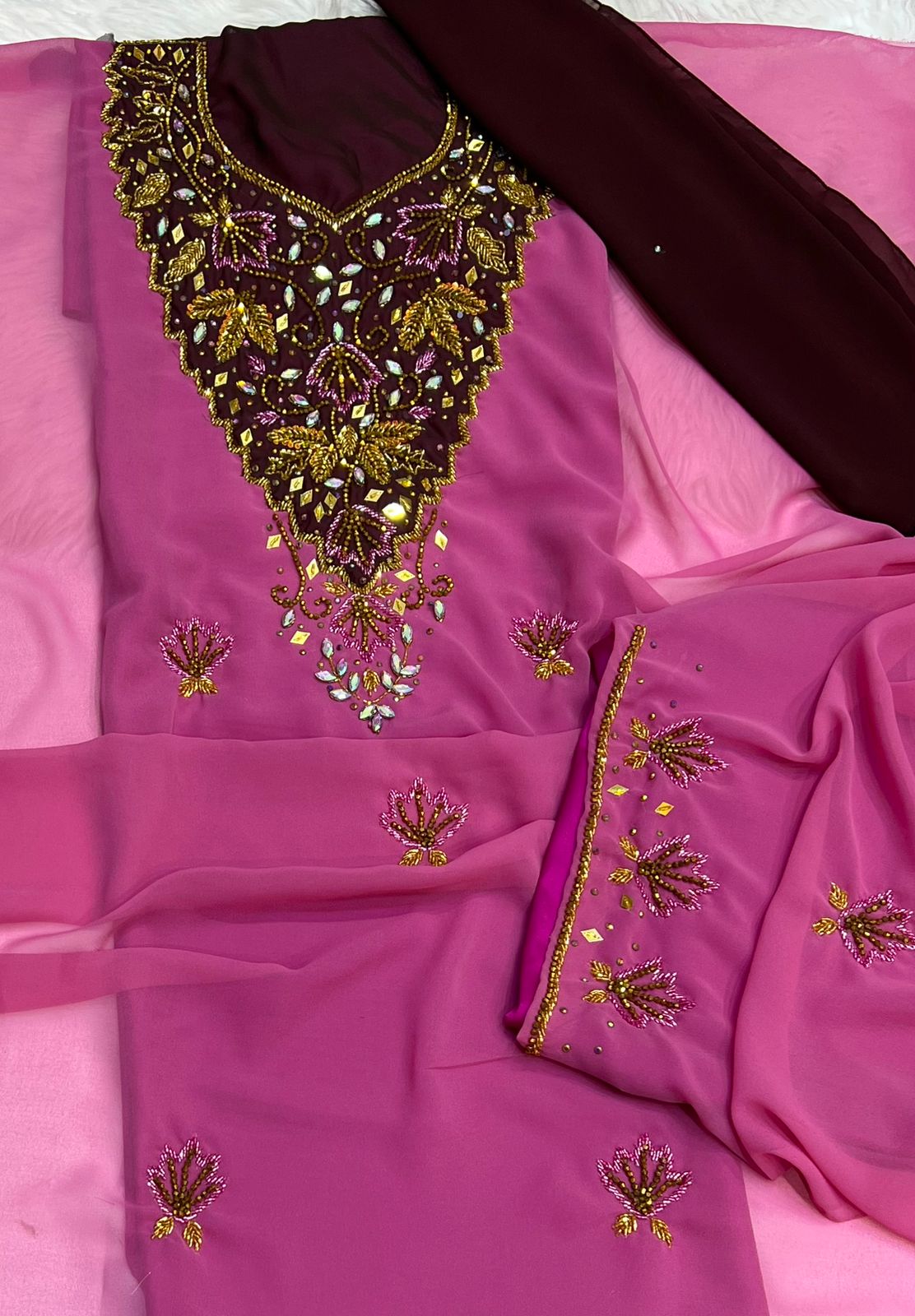 A new dress crafted from luxurious chiffon, adorned with elegant hand-beaded embroidery