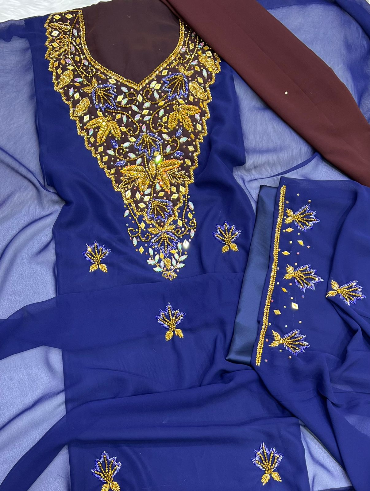 A new dress crafted from luxurious chiffon, adorned with elegant hand-beaded embroidery