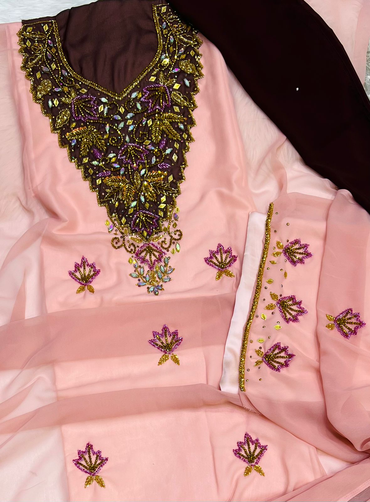 A new dress crafted from luxurious chiffon, adorned with elegant hand-beaded embroidery