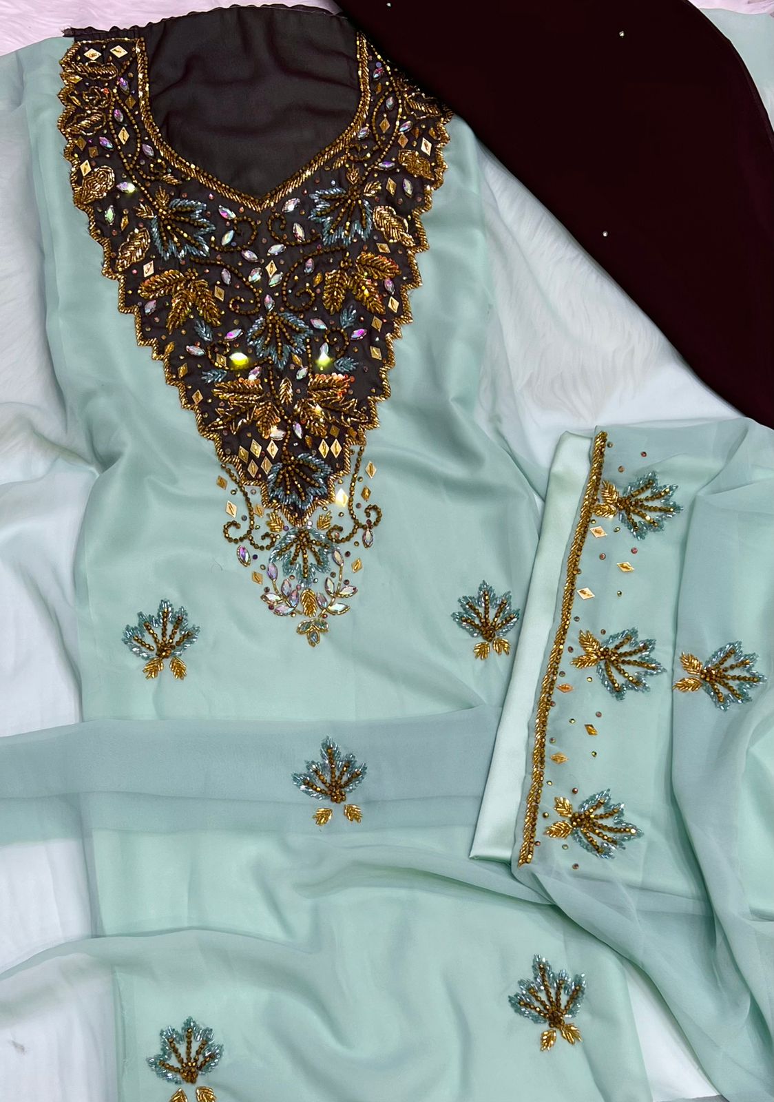 A new dress crafted from luxurious chiffon, adorned with elegant hand-beaded embroidery