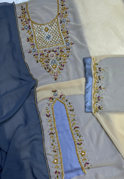 A luxurious abaya crafted from soft chiffon, embellished with delicate beaded embroidery extending down the bodice