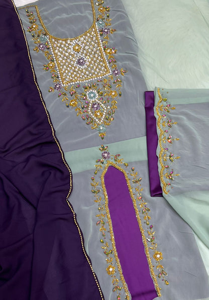 A luxurious abaya crafted from soft chiffon, embellished with delicate beaded embroidery extending down the bodice