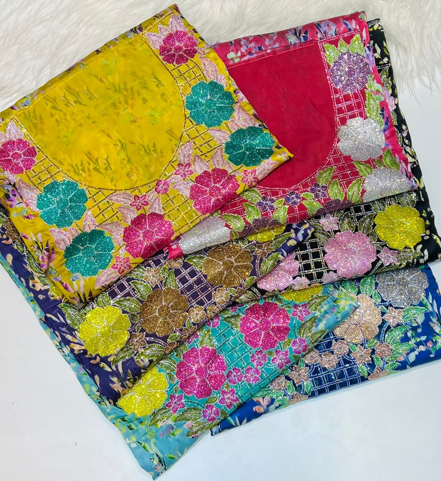 Italian raw silk fabric embellished with intricate embroidery featuring 6-pointed stones and an elegant hemline