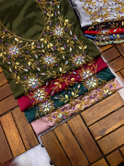 This stunning piece features luxurious Armani silk with intricate Moroccan beadwork, adding an authentic and elegant touch