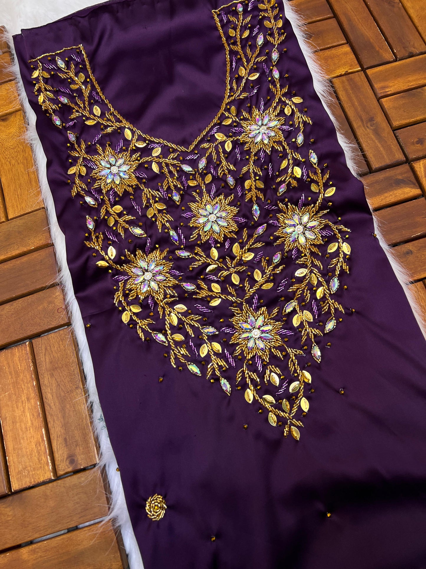 This stunning piece features luxurious Armani silk with intricate Moroccan beadwork, adding an authentic and elegant touch