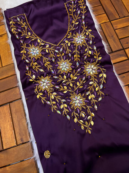 This stunning piece features luxurious Armani silk with intricate Moroccan beadwork, adding an authentic and elegant touch