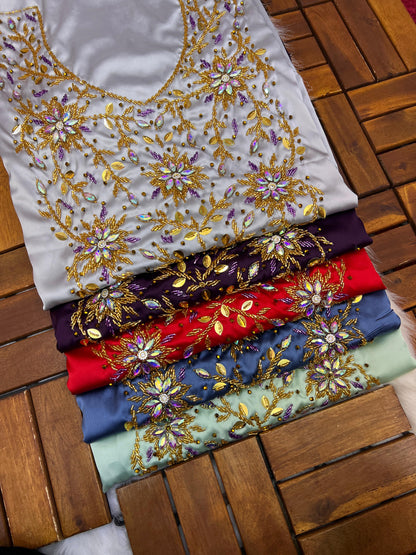 This stunning piece features luxurious Armani silk with intricate Moroccan beadwork, adding an authentic and elegant touch