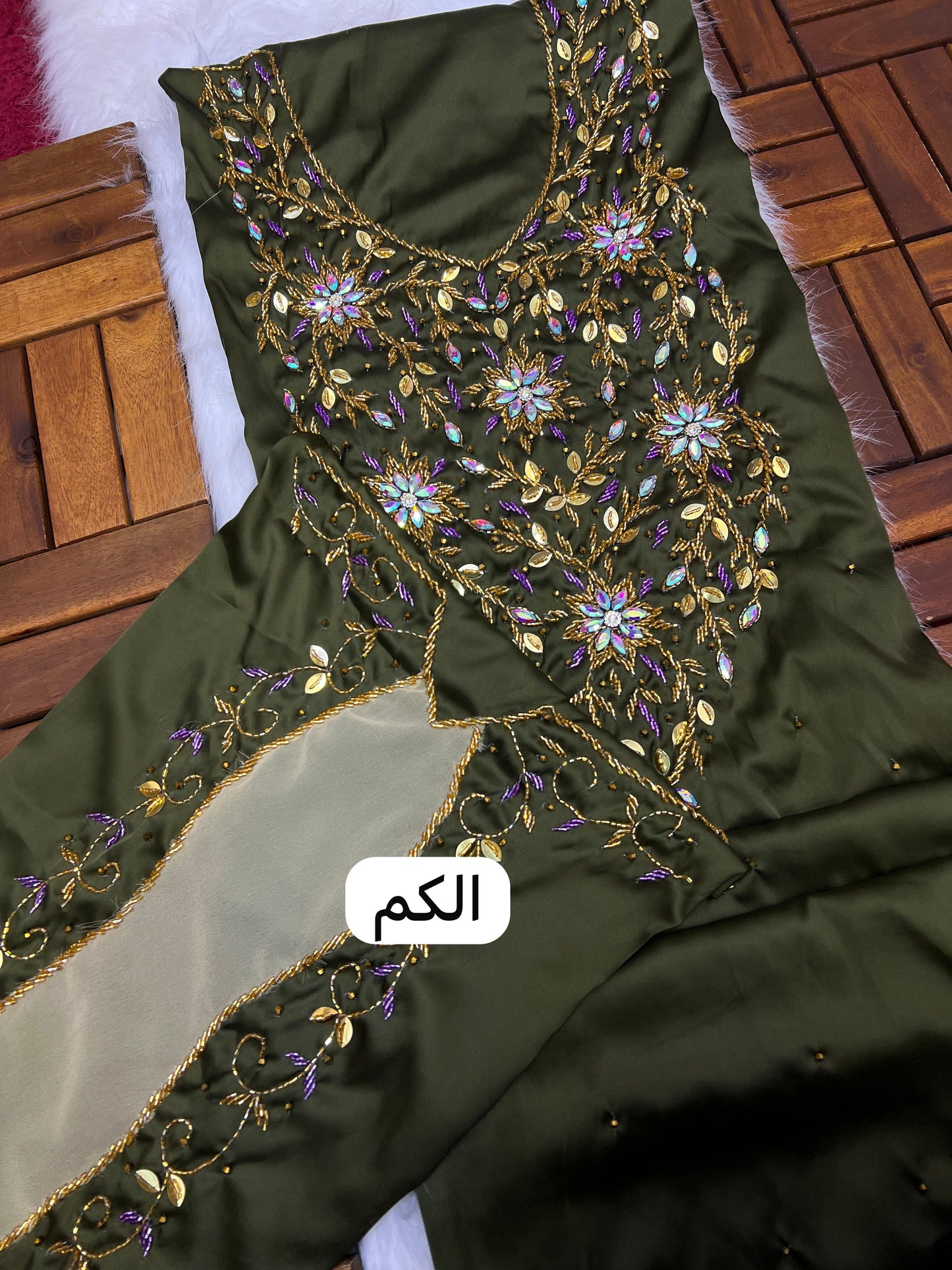 This stunning piece features luxurious Armani silk with intricate Moroccan beadwork, adding an authentic and elegant touch