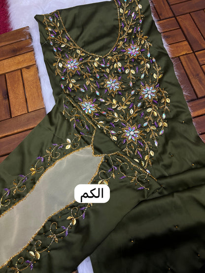 This stunning piece features luxurious Armani silk with intricate Moroccan beadwork, adding an authentic and elegant touch