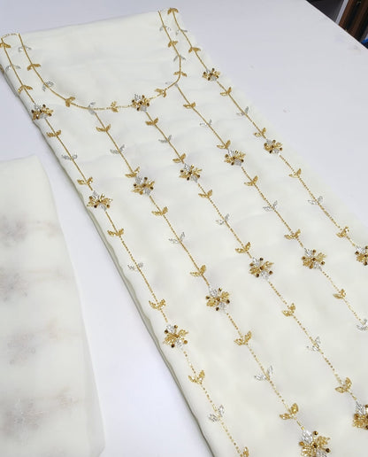 This chiffon dress features an elegant lining and is fully embellished with delicate beading, adding a touch of luxury and sophistication