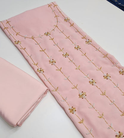 This chiffon dress features an elegant lining and is fully embellished with delicate beading, adding a touch of luxury and sophistication