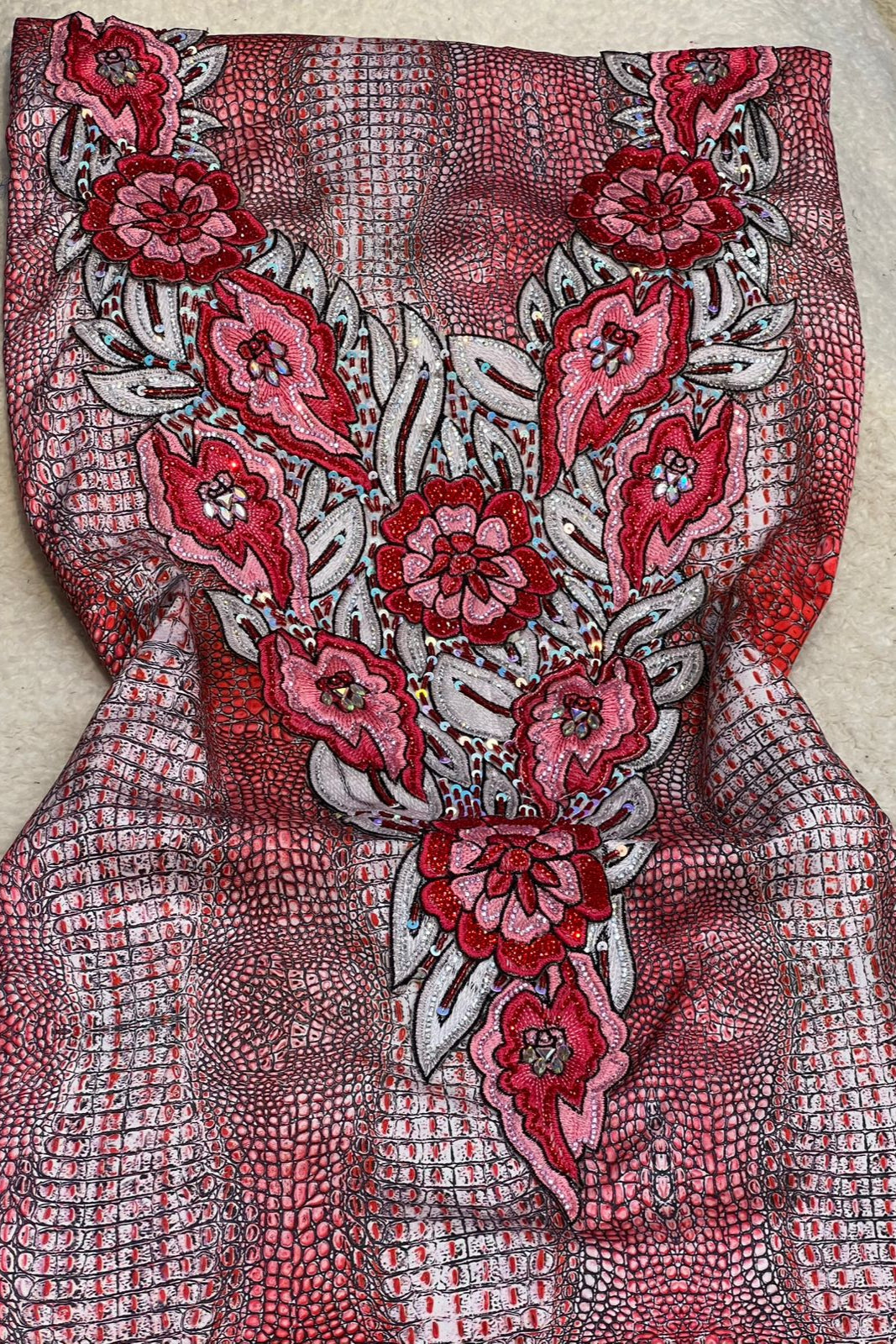 This authentic Italian silk fabric features intricate 3D embroidery with crystals and hand-beaded details