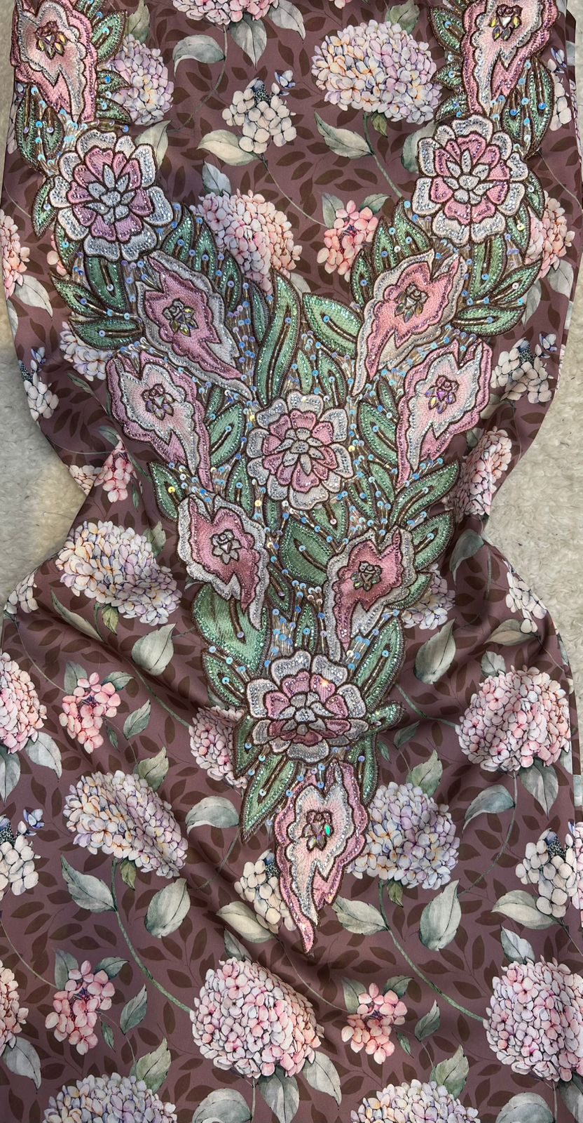 This authentic Italian silk fabric features intricate 3D embroidery with crystals and hand-beaded details
