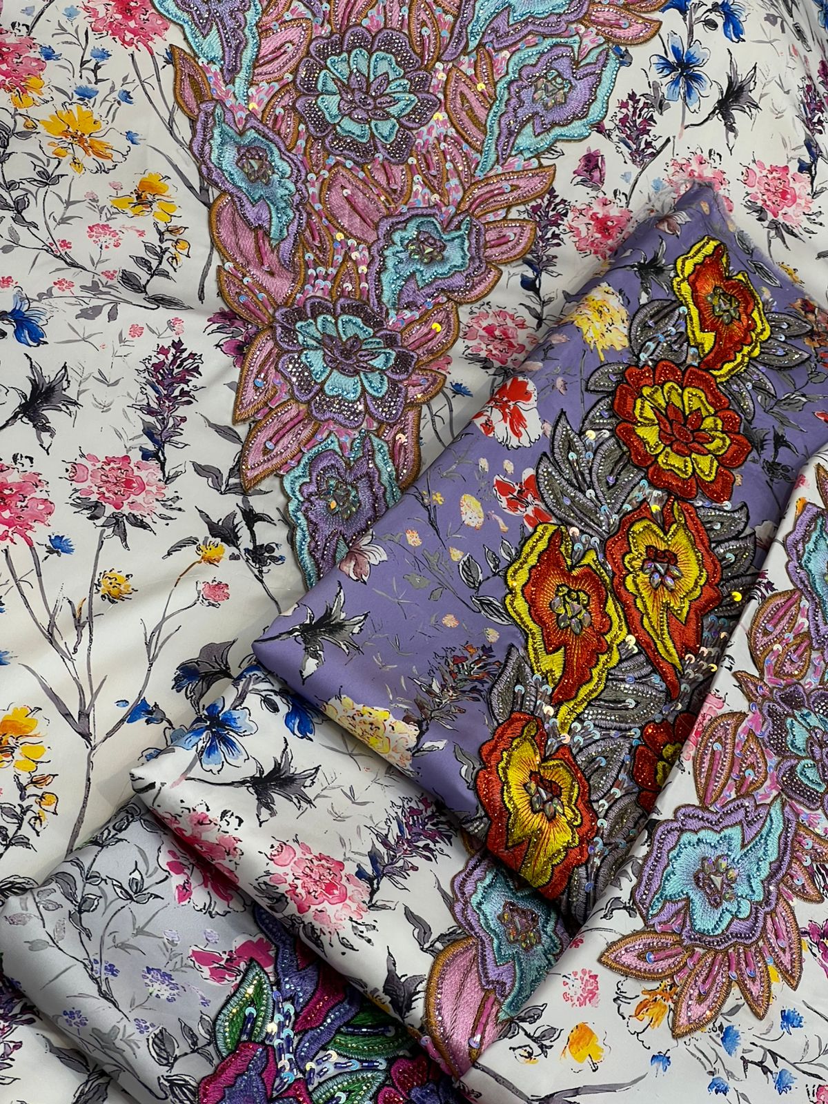 This authentic Italian silk fabric features intricate 3D embroidery with crystals and hand-beaded details