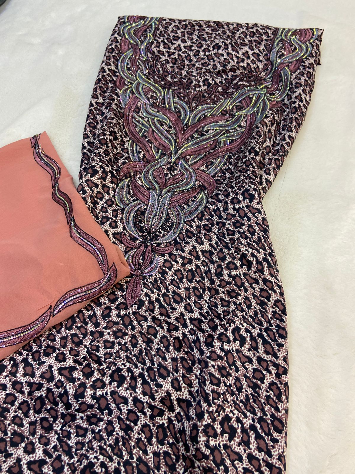 Luxurious Indonesian silk with a newly designed shawl that adds an elegant touch thanks to its distinctive beading. Style No. 6 is now available