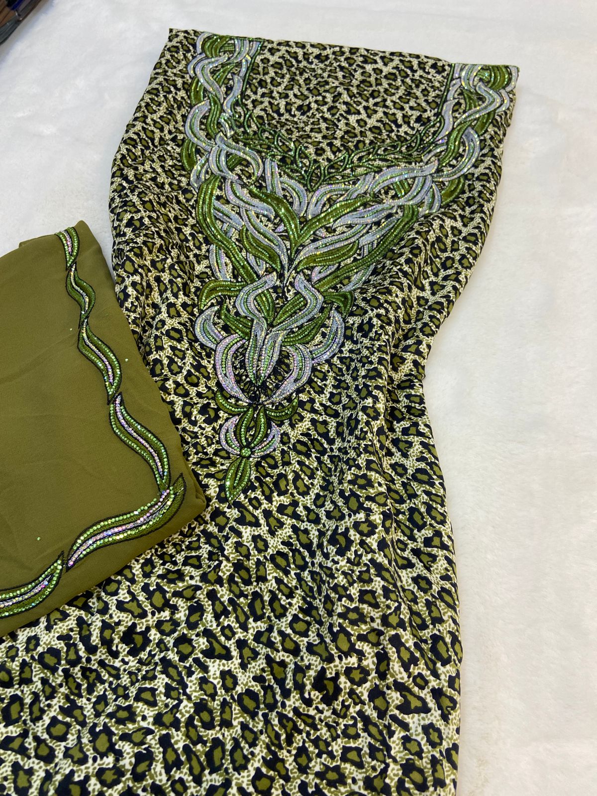 Luxurious Indonesian silk with a newly designed shawl that adds an elegant touch thanks to its distinctive beading. Style No. 6 is now available