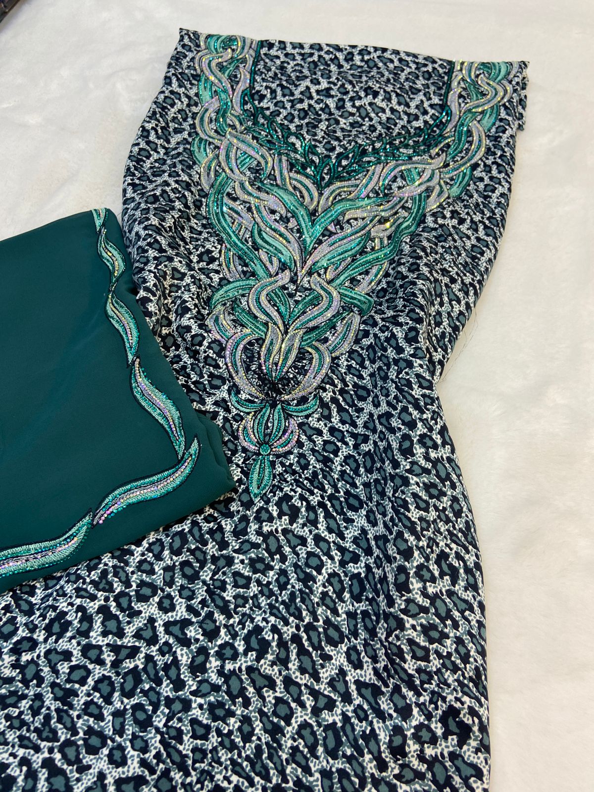 Luxurious Indonesian silk with a newly designed shawl that adds an elegant touch thanks to its distinctive beading. Style No. 6 is now available