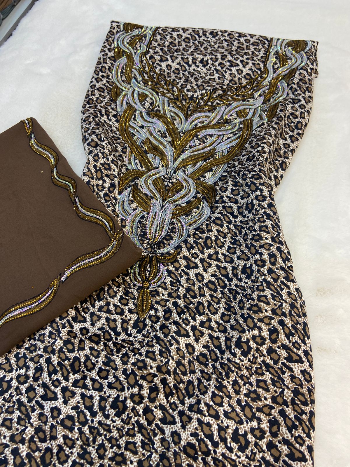 Luxurious Indonesian silk with a newly designed shawl that adds an elegant touch thanks to its distinctive beading. Style No. 6 is now available
