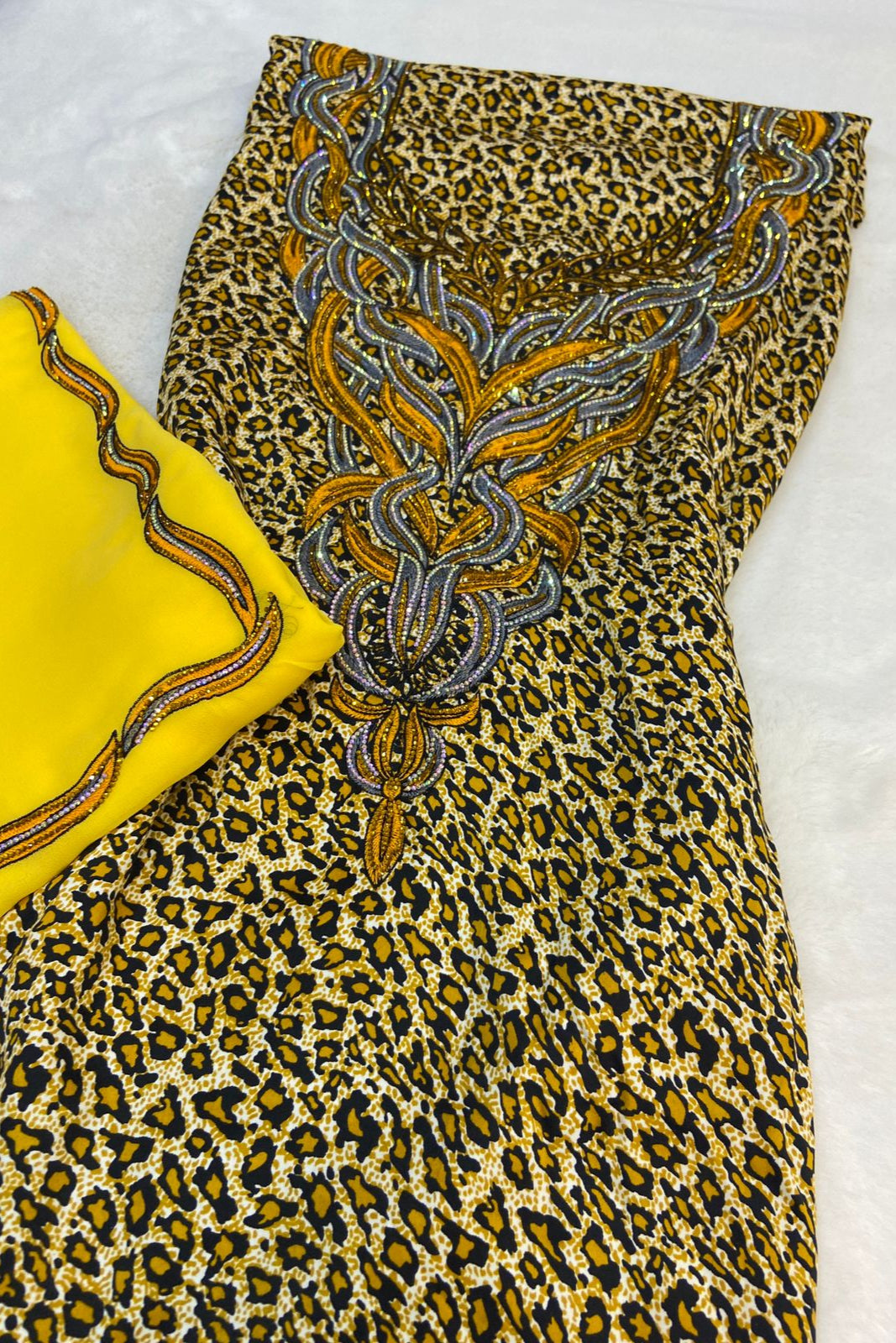 Luxurious Indonesian silk with a newly designed shawl that adds an elegant touch thanks to its distinctive beading. Style No. 6 is now available