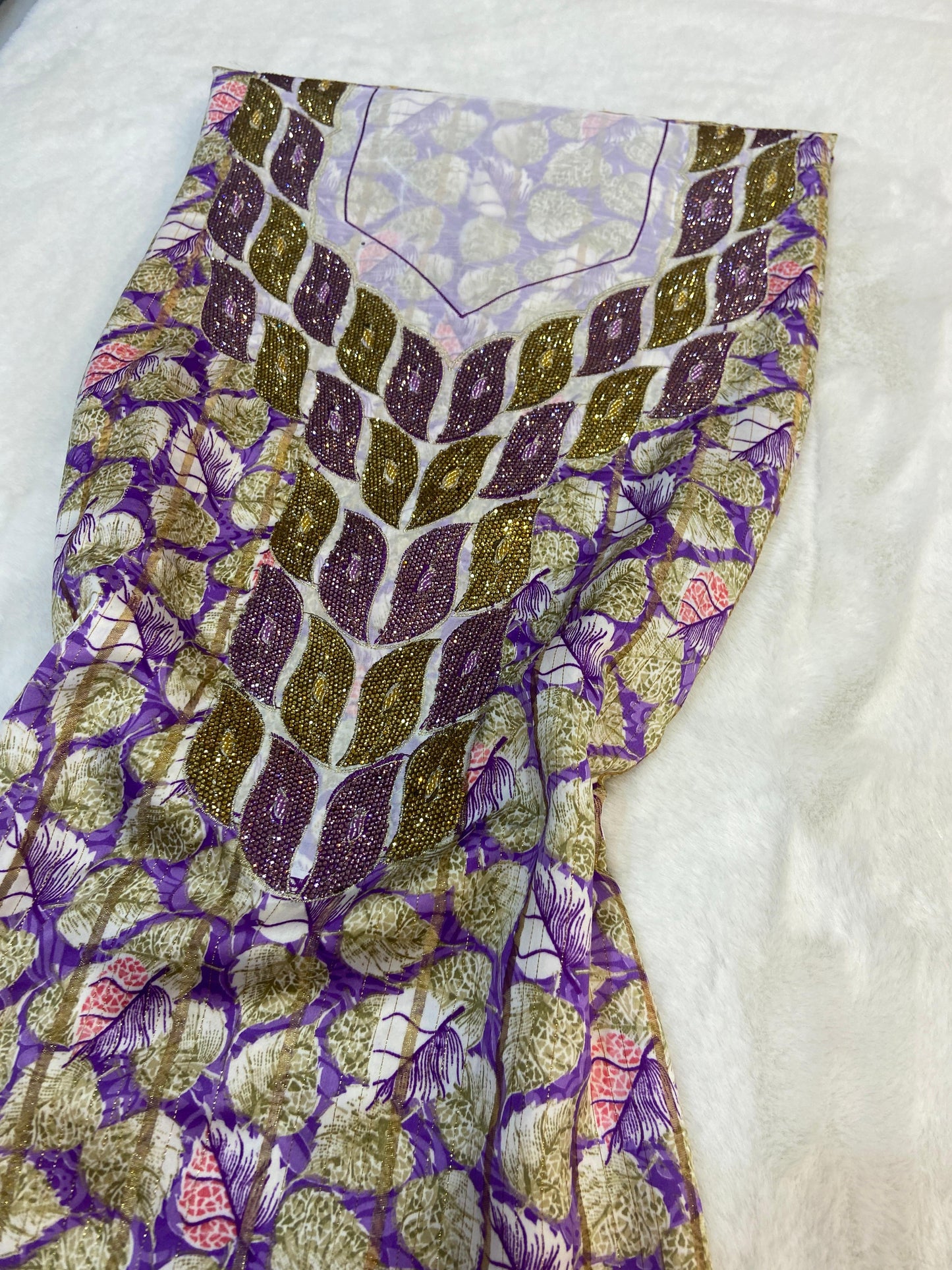 This luxurious Indonesian silk is presented in a new design, adorned with delicately set stones and six beads