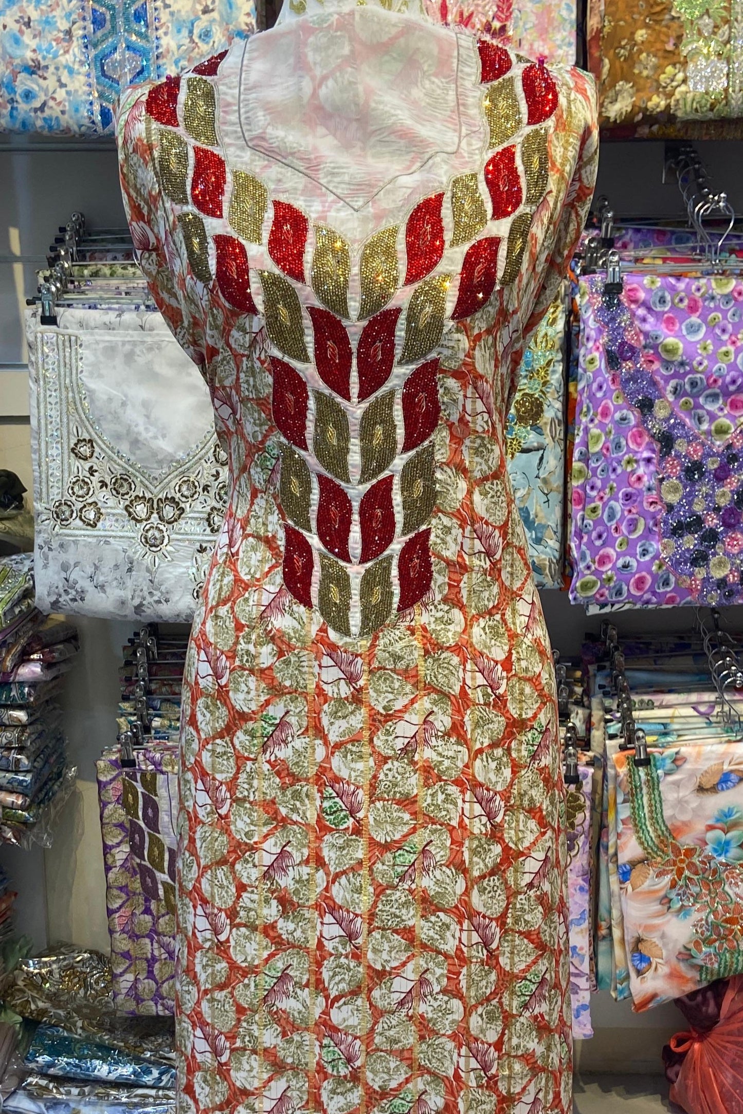 This luxurious Indonesian silk is presented in a new design, adorned with delicately set stones and six beads