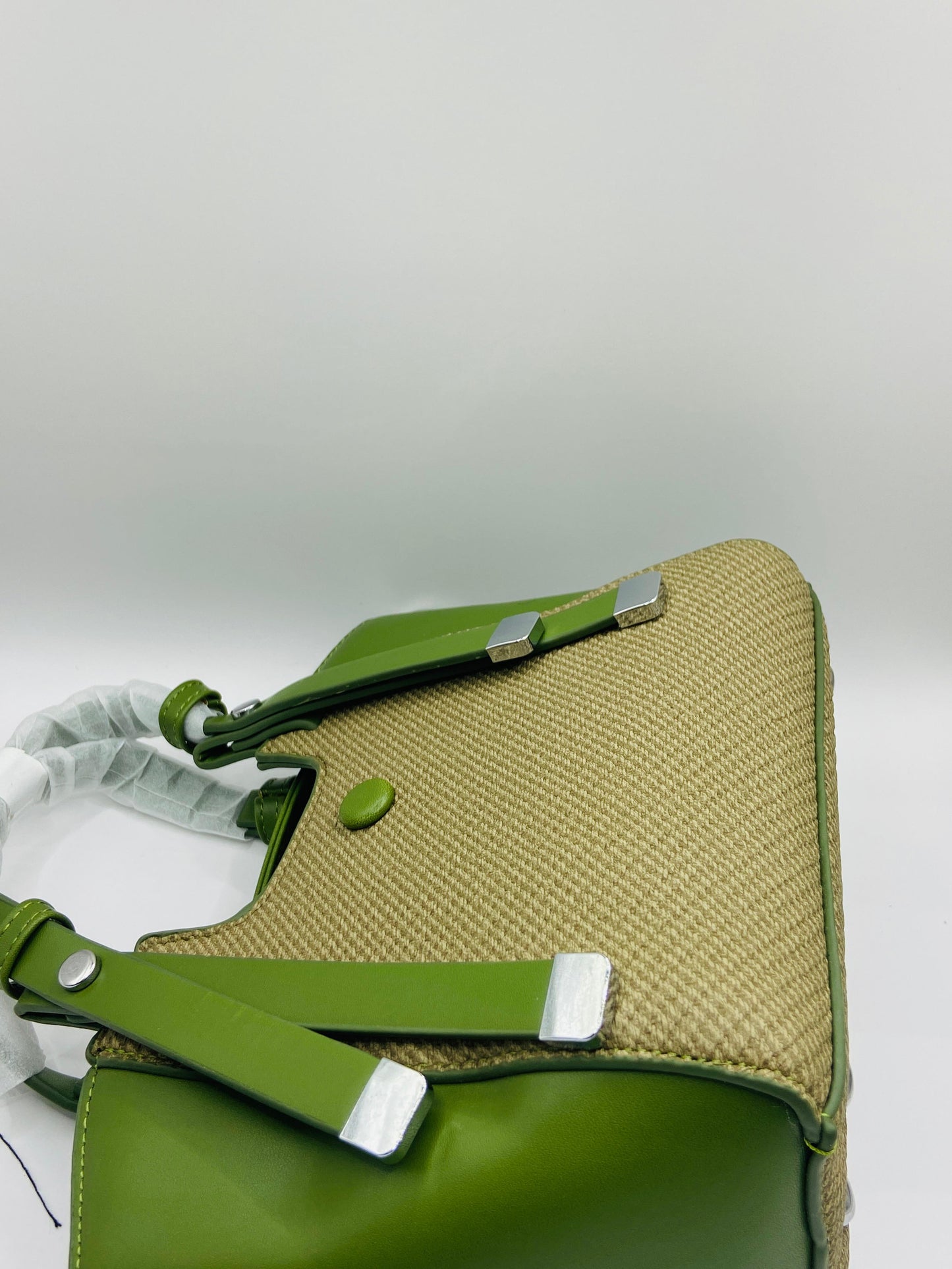 This handbag is a structured, genuine leather tote-style bag designed for modern women who value both elegance and functionality.