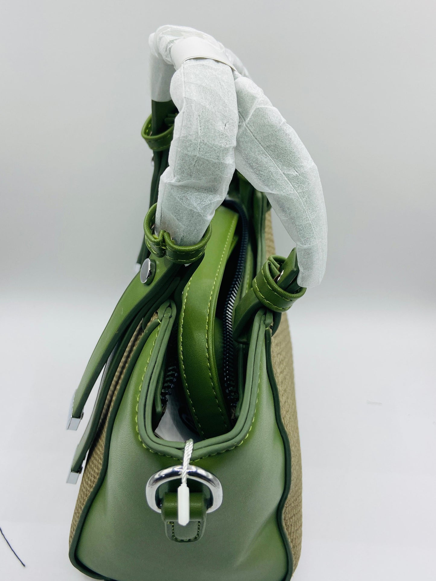 This handbag is a structured, genuine leather tote-style bag designed for modern women who value both elegance and functionality.
