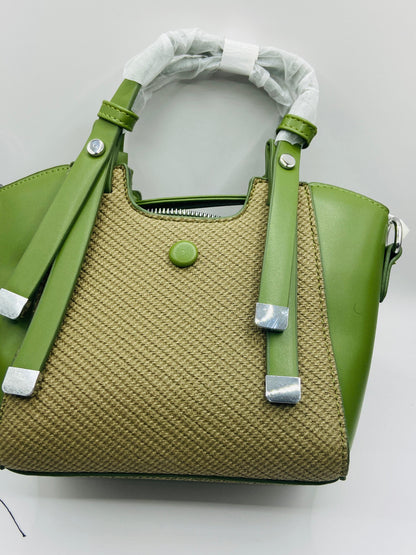 This handbag is a structured, genuine leather tote-style bag designed for modern women who value both elegance and functionality.