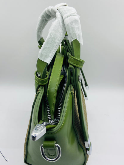 This handbag is a structured, genuine leather tote-style bag designed for modern women who value both elegance and functionality.
