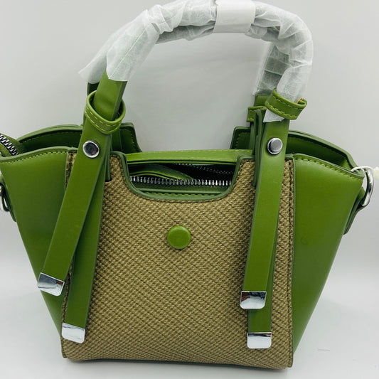 This handbag is a structured, genuine leather tote-style bag designed for modern women who value both elegance and functionality.