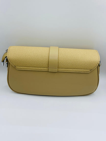 This handbag is a structured, genuine leather tote-style bag designed for modern women who value both elegance and functionality.