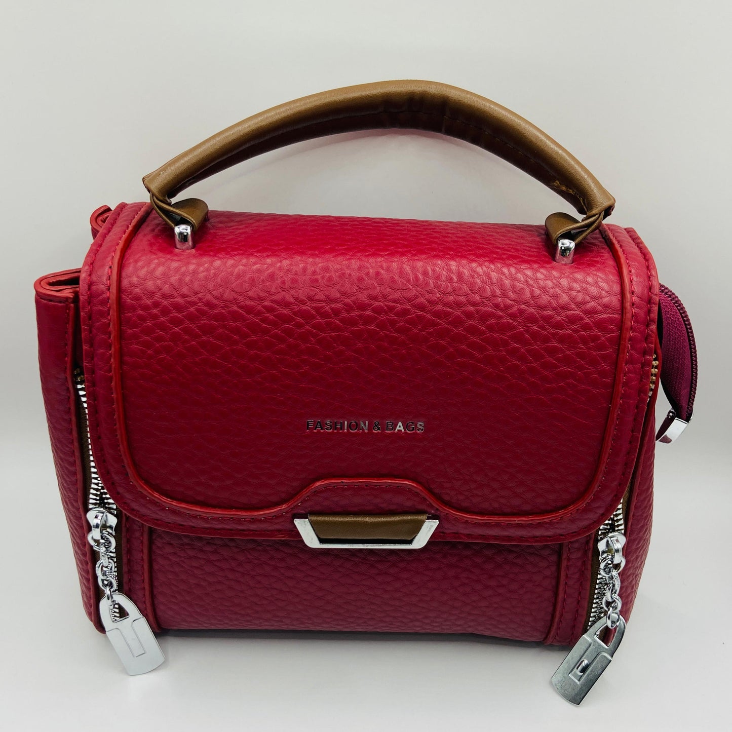 This handbag is a structured, genuine leather tote-style bag designed for modern women who value both elegance and functionality.