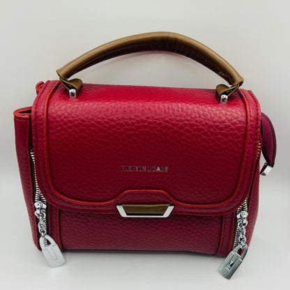 This handbag is a structured, genuine leather tote-style bag designed for modern women who value both elegance and functionality.