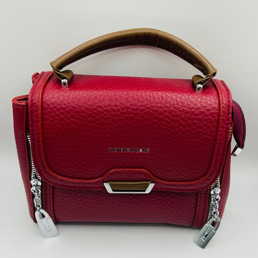 This handbag is a structured, genuine leather tote-style bag designed for modern women who value both elegance and functionality.