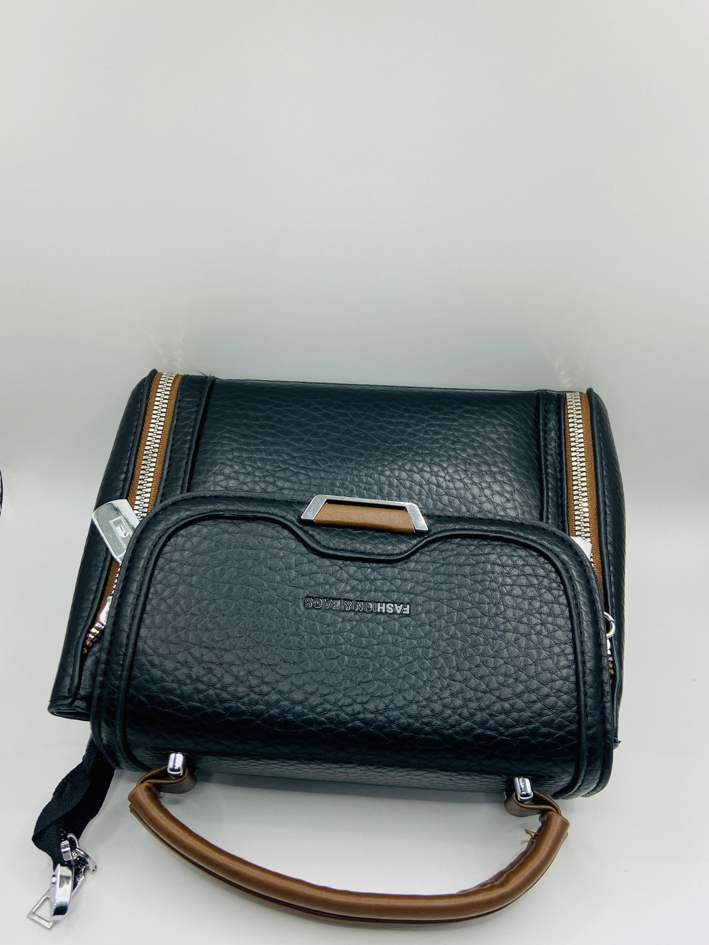 This handbag is a structured, genuine leather tote-style bag designed for modern women who value both elegance and functionality.