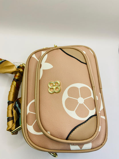 This handbag is a structured, genuine leather tote-style bag designed for modern women who value both elegance and functionality.