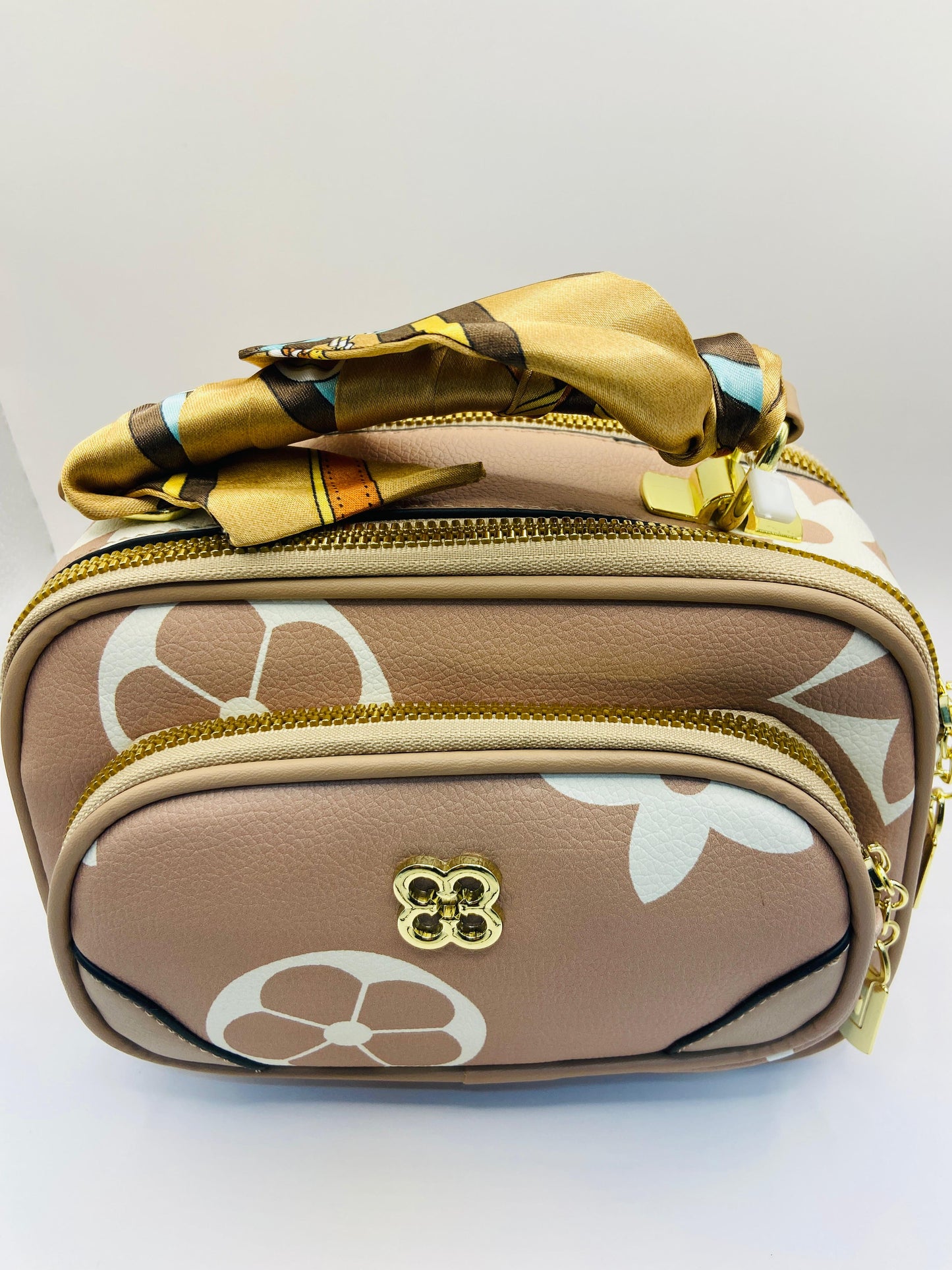 This handbag is a structured, genuine leather tote-style bag designed for modern women who value both elegance and functionality.