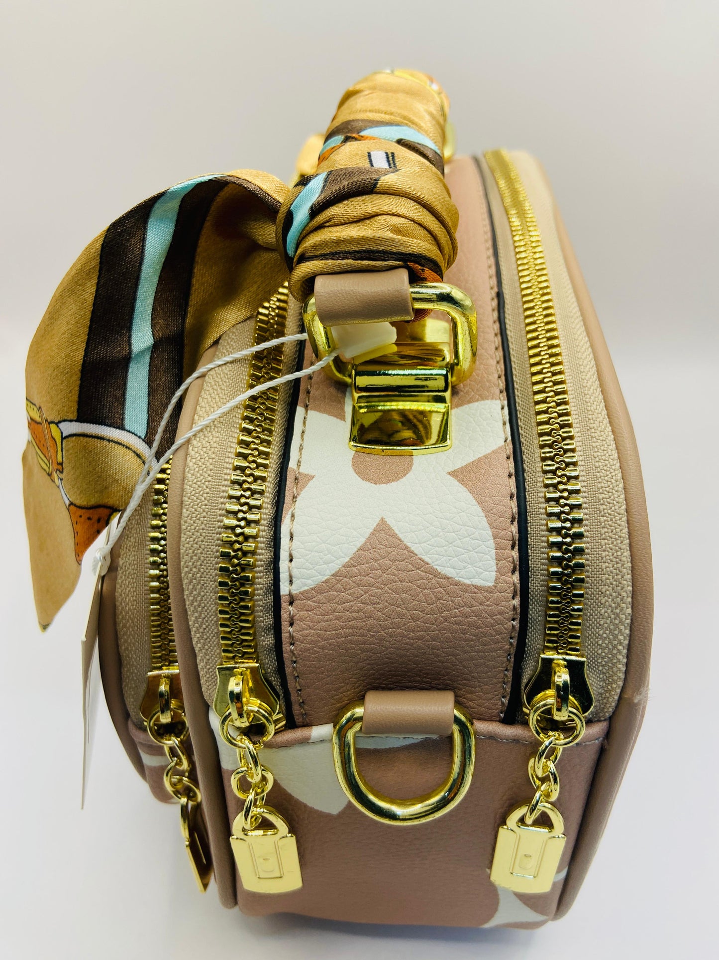 This handbag is a structured, genuine leather tote-style bag designed for modern women who value both elegance and functionality.