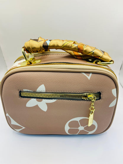 This handbag is a structured, genuine leather tote-style bag designed for modern women who value both elegance and functionality.