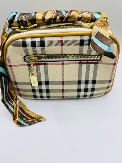 This handbag is a structured, genuine leather tote-style bag designed for modern women who value both elegance and functionality.
