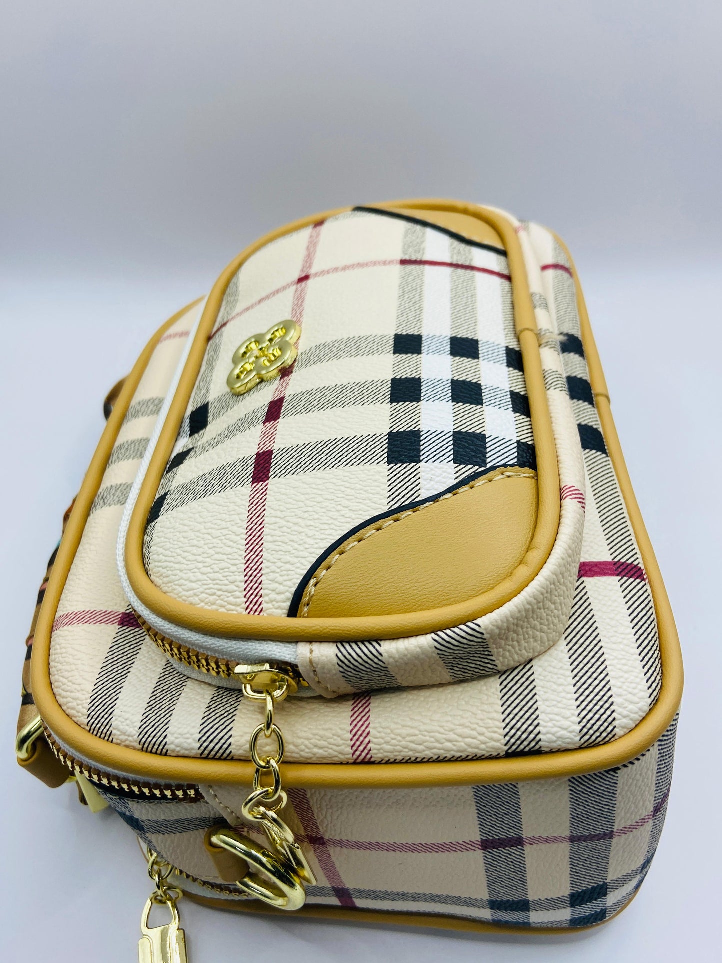 This handbag is a structured, genuine leather tote-style bag designed for modern women who value both elegance and functionality.