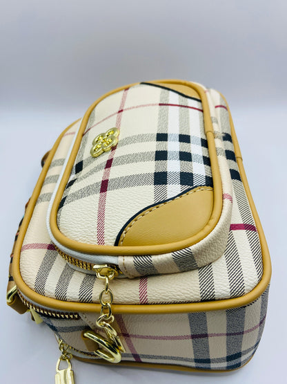 This handbag is a structured, genuine leather tote-style bag designed for modern women who value both elegance and functionality.